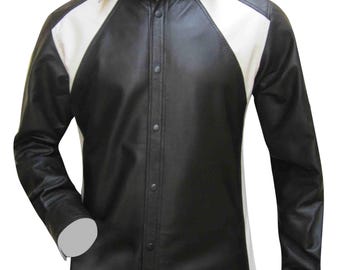 May include: A black leather shirt with white panels on the shoulders and upper chest. The long-sleeved shirt has a button-down front and a white collar. The shirt is made of a smooth, shiny material.