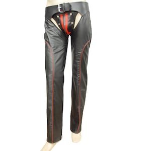 May include: Black leather chaps with red accent stitching and a red panel on the front. The chaps have a wide belt with a silver buckle. The chaps are displayed on a mannequin.