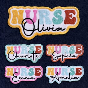 May include: Embroidered patches with the word "NURSE" in retro-style lettering, with names like Olivia, Charlotte, Sophia, Emma, and Amelia. The patches feature a variety of colors, including pink, blue, orange, and brown, with a yellow border.