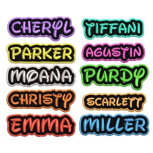 May include: A collection of embroidered name patches in various colors, including purple, teal, yellow, pink, white, green, orange, and red. Each patch features a different name, such as "Cheryl," "Tiffani," and "Parker," with a black border.