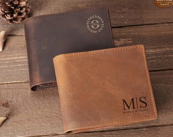 May include: Two leather wallets, one brown and one tan. The brown wallet has a monogram with the letter "O" inside a wreath. The tan wallet has the initials "M.S." and the text "Michael & Sophia".