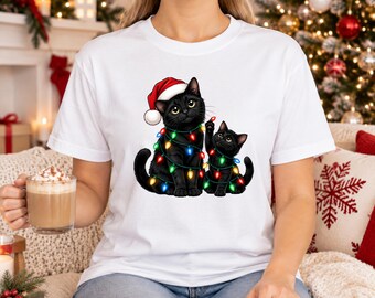 Weihnachts-T-Shirt mit schwarzen Katzen, süßes Katzen-Weihnachtsbeleuchtungs-Shirt, Weihnachtsmannmütze-Katzen-Weihnachtsoberteil, Weihnachtsgeschenk für Katzenmamas, Weihnachtsgeschenk für Katzenliebhaber