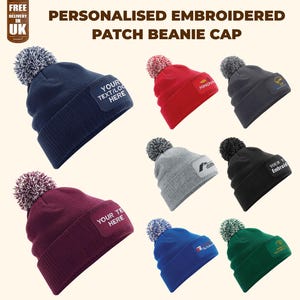 May include: A selection of personalised embroidered patch beanie caps in colours such as navy, red, grey, black, burgundy, blue, and green. Each hat has a pom-pom and a patch for custom text or logos. The text "YOUR TEXT/LOGO HERE" is visible on some patches.