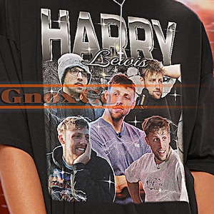 May include: Black unisex t-shirt featuring a graphic of the text "HARRY Bervis" above a collage of images. The shirt has short sleeves and a crew neck. The T-shirt is from "TSHIRT Unisex".