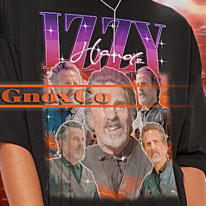 May include: Black unisex t-shirt with a vintage-style graphic of a band called "Izzy Hatre" and the text "GnoxCo".