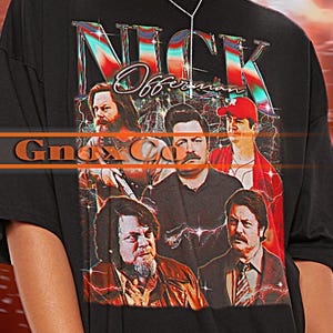 May include: Black unisex t-shirt featuring a graphic print of a band called "Nick Offerman & The Gnarly Companions". The model is wearing a 2XL size shirt. To achieve an oversized look, order one or two sizes larger than your usual size.