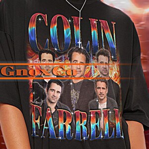 May include: Black unisex t-shirt with a colorful graphic print of Colin Farrell's face. The text "Colin Farrell" is printed in a rainbow gradient.