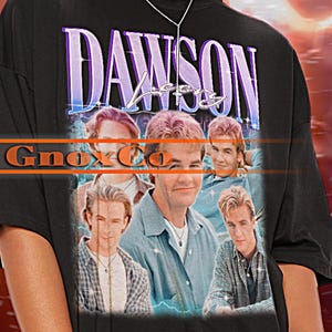 May include: Black t-shirt with a graphic print of the cast of Dawson's Creek. The shirt has a distressed look and the text "Dawson's Creek" is printed in purple.