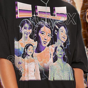 May include: Black unisex t-shirt featuring a graphic of multiple women with a purple and orange design. The shirt has the text "TSHIRT Unisex" at the top. The model is wearing a 2XL shirt. For an oversized look, choose +1 or +2 sizes.