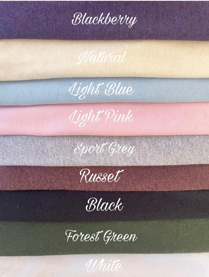 May include: A color palette featuring fabric swatches in various shades. The colors include Blackberry, Natural, Light Blue, Light Pink, Sport Grey, Russet, Black, Forest Green, and White. Each swatch has its color name written in cursive.