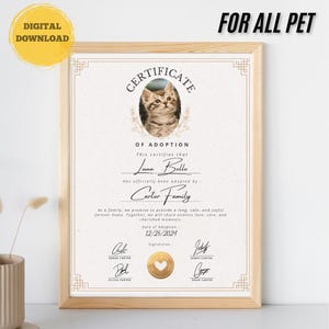 May include: A certificate of adoption for a cat named Luna Belle, adopted by the Carter family. The certificate is printed on cream-coloured paper with a gold border and features a photo of the cat. The date of adoption is 12/25/2024.