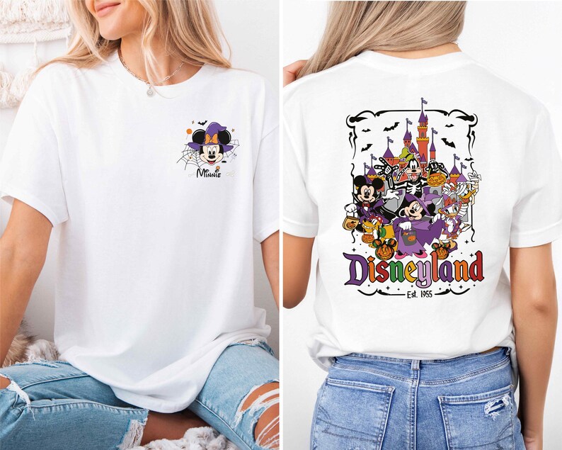 A woman wearing a white t-shirt with a graphic of Minnie Mouse and Disneyland on the back, as well as a graphic of a castle and bats on the front.