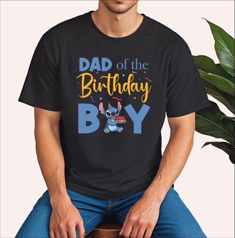 a man sitting on a stool wearing a shirt that says dad of the birthday boy