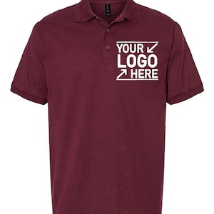 A burgundy-colored polo shirt with a white logo on the left side of the chest.