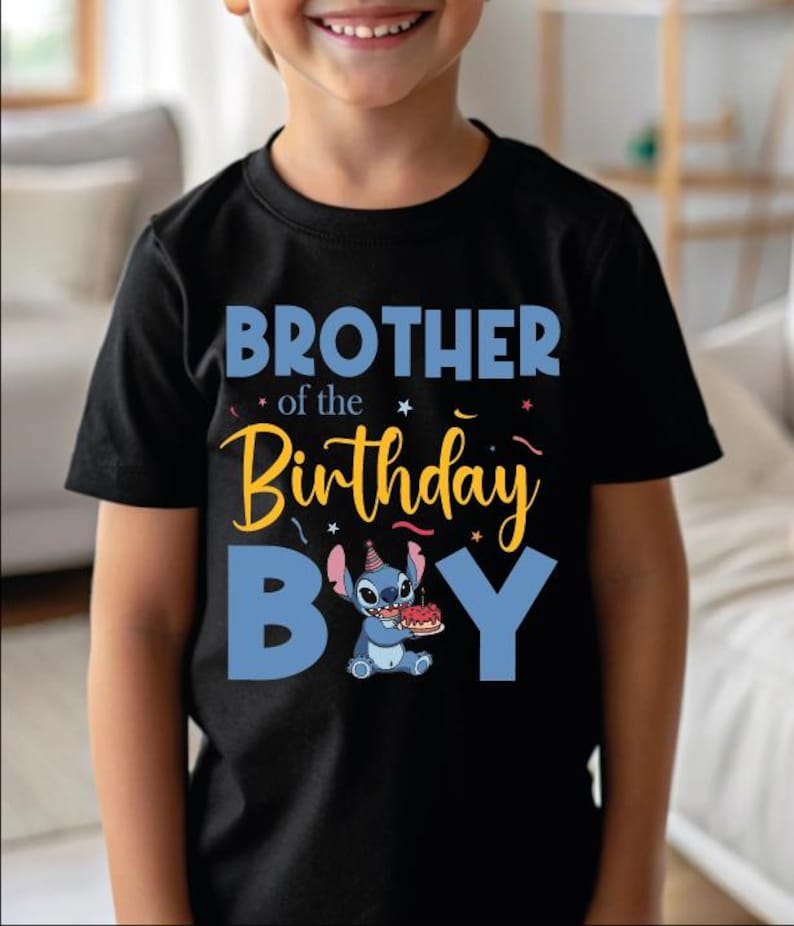 a young boy wearing a black shirt with the words brother of the birthday boy on