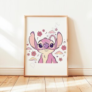 May include: A framed print featuring a cartoon character in shades of pink and purple. The character has large ears and is surrounded by pink flowers, clouds, musical notes, and stars. The artwork is set against a white background.