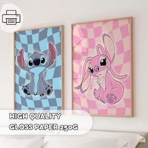 May include: Two framed cartoon character prints. One features a blue and gray character on a blue and gray checkered background. The other print shows a pink character on a pink and white checkered background. The text "HIGH QUALITY GLOSS PAPER 250G" is at the bottom.