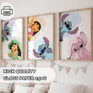 May include: Three framed art prints featuring cartoon characters. The prints showcase Stitch, Lilo, and Angel, with colorful watercolor backgrounds. The frames are light brown. The text "HIGH QUALITY GLOSS PAPER 250G" is visible.