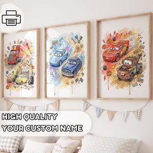 May include: Three framed watercolor prints featuring cartoon cars. The prints showcase a red truck, a yellow car, two blue cars, and a red race car with a brown tow truck. The prints have a watercolor background with splashes of color and racing-themed elements.