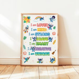 May include: A framed print featuring the character Stitch with the phrases "I am LOVED, KIND, STRONG, BRAVE, SMART, CREATIVE, UNIQUE" in colorful text. The print includes illustrations of Stitch, a rainbow, flowers, and a rocket ship.