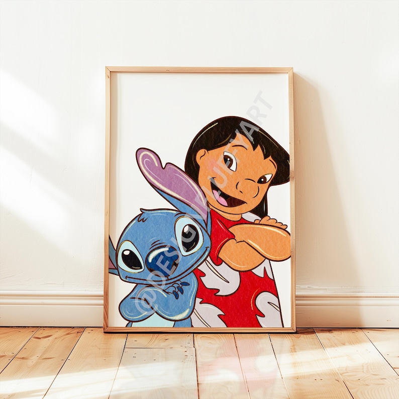 May include: A framed print featuring the characters Lilo and Stitch. Lilo, with black hair and a red dress, stands with her arms crossed. Stitch, a blue alien, is beside her. The print is in a wooden frame and set against a white wall.