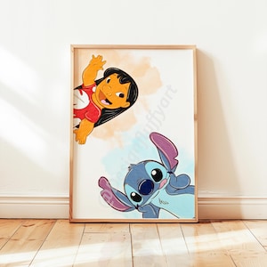 May include: A framed print featuring cartoon characters Lilo and Stitch. Lilo, in a red shirt, waves from the top left. Stitch, in blue, is at the bottom right. The background has orange and blue watercolour-style splashes.
