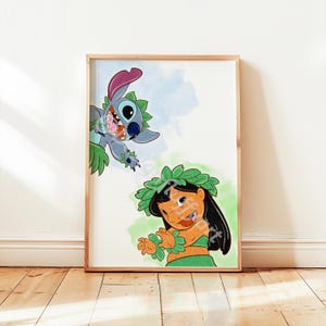 May include: A framed print with a vibrant illustration of Lilo and Stitch. Stitch, a blue alien, is playfully reaching towards Lilo, who is wearing a green hula outfit. The background features watercolour splashes of blue and green.