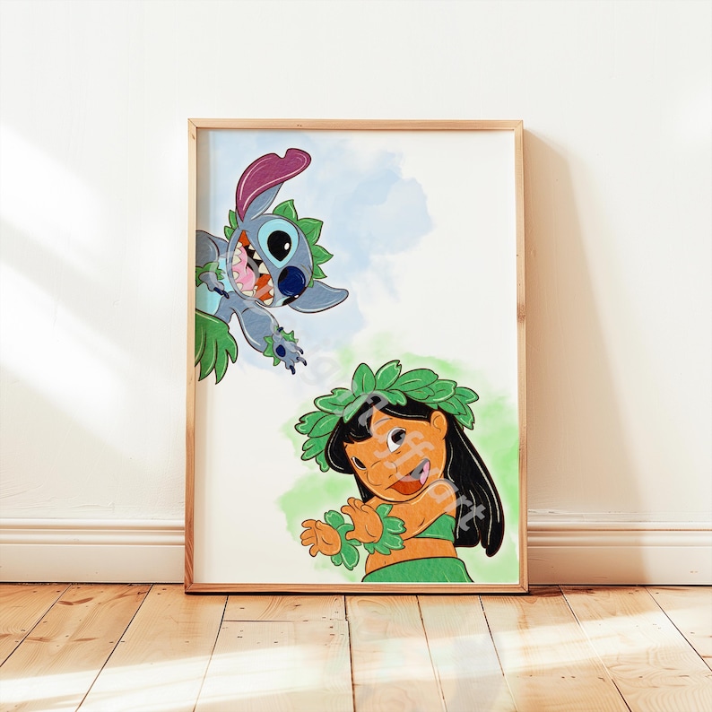 May include: A framed print with a vibrant illustration of Lilo and Stitch. Stitch, a blue alien, is playfully reaching towards Lilo, who is wearing a green hula outfit. The background features watercolour splashes of blue and green.