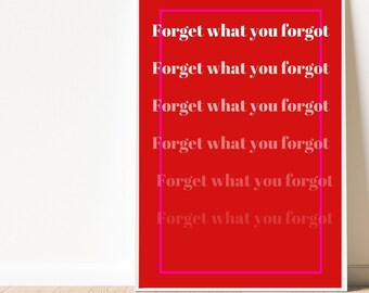 May include: A framed art print featuring the phrase "Forget what you forgot" repeated six times in white and pink against a red backdrop. The text is within a pink rectangular border.