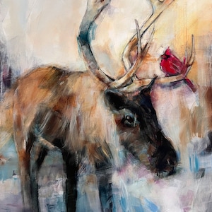 May include: An oil painting depicts a reindeer with large antlers, rendered in shades of brown, tan, and black. A bright red cardinal perches on the antlers. The background features soft, blended colors of white, blue, and yellow.