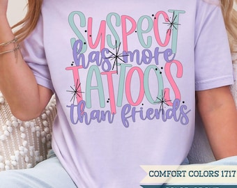 Suspect Has More Tattoos Than Friends Shirt | Funny Tattoo Shirt | Sarcastic Tattoo Humor Tee | Relatable Inked | Comfort Colors® T-Shirt
