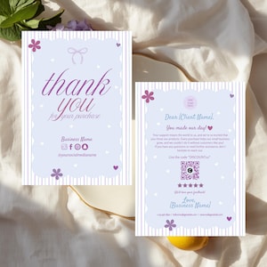 May include: Two rectangular thank you cards with a light purple background, white scalloped borders, and vertical stripes. The cards feature purple floral accents, heart icons, a bow graphic, social media icons, a QR code, and placeholder text.
