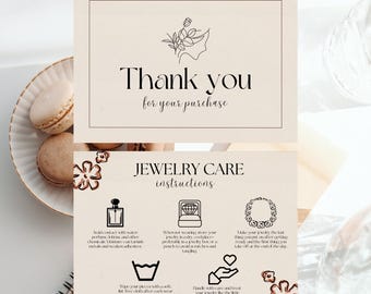May include: Two cream-colored cards with text that reads "Thank you for your purchase" and "JEWELRY CARE instructions." The cards are on a light background with macarons on a plate. The jewelry care card has icons and text.