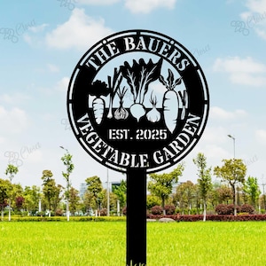 May include: Black metal sign with the text "The Bauers Vegetable Garden Est. 2025" and a silhouette of various vegetables.