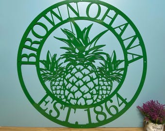 May include: Green metal pineapple design with the text "Brown Ohana Est 1864" in a circle.