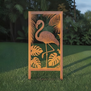 May include: A rectangular, rusty-orange metal garden art piece featuring a flamingo silhouette surrounded by tropical leaves. The flamingo is standing on one leg. The art piece is set on a grassy lawn with a blurred background of palm trees.