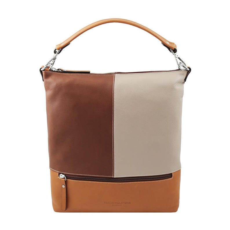 Chic and fashionable leather tote in a color-block pattern of brown, beige, and tan. This versatile women’s bag has a top handle and a compact design, ideal as an office tote or quality leather purse for daily use.