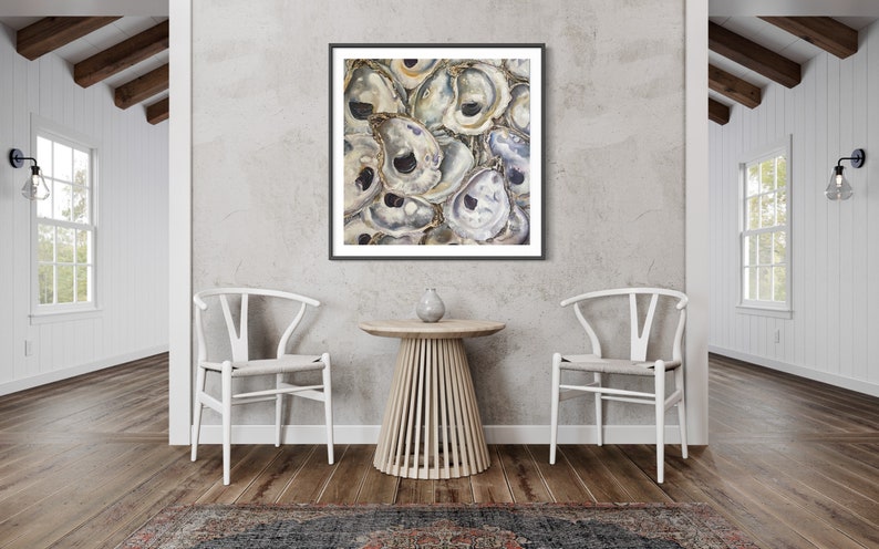May include: A framed painting of a cluster of oyster shells in shades of white, gray, and brown. The shells are arranged in a random pattern, creating a textured and organic look.