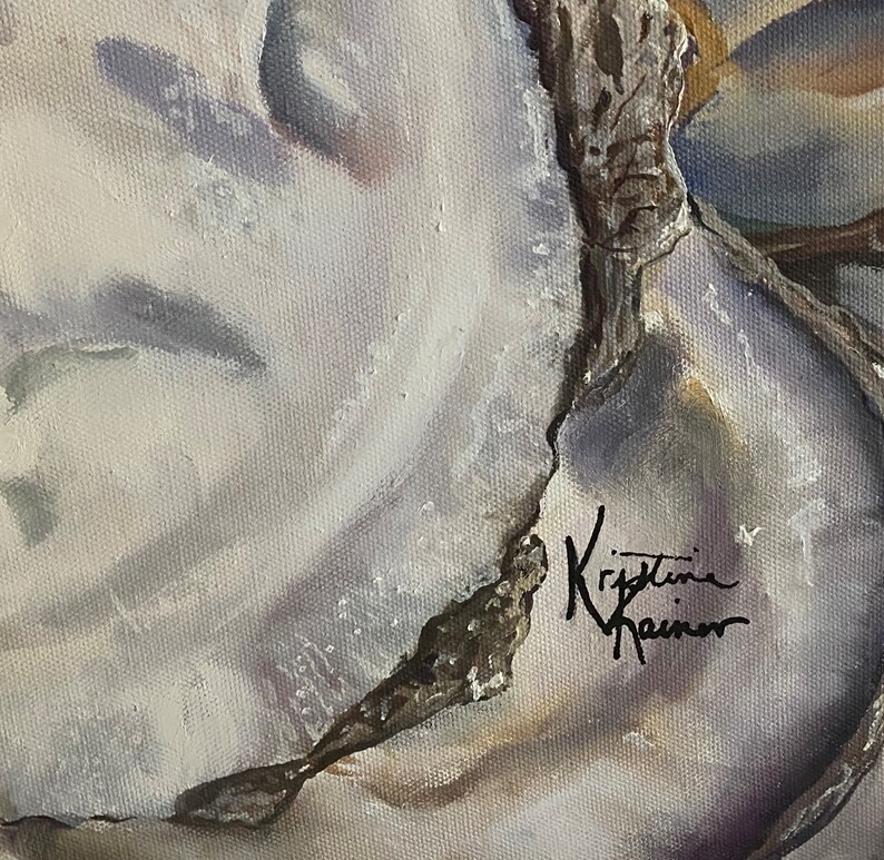 May include: A close-up of a white oyster shell with a brown, textured edge. The shell has a subtle purple hue and a signature that reads "Kristine Rainer".