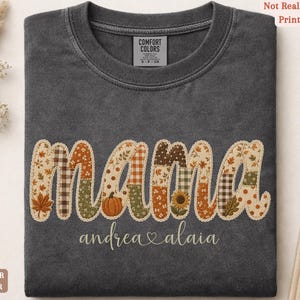 Personalized Mama Comfort Colors shirt with custom kids names, fall patchwork letters, pumpkins, florals, and faux embroidery effect in warm autumn tones on an pepper tee.