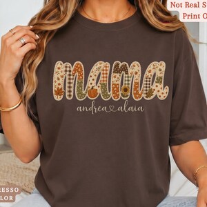 Personalized Mama Comfort Colors shirt with custom kids names, fall patchwork letters, pumpkins, florals, and faux embroidery effect in warm autumn tones on an espresso tee.