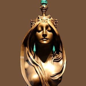May include: A bronze sculpture of a woman's bust with flowing hair and a crown. The sculpture is on a marble base and has a green gemstone on top of the crown.