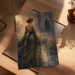 May include: An art print featuring a woman in a flowing green dress, standing in a sunlit forest clearing. A dark figure is in the background. The artwork has a romantic, ethereal quality, with soft colors and detailed brushstrokes.