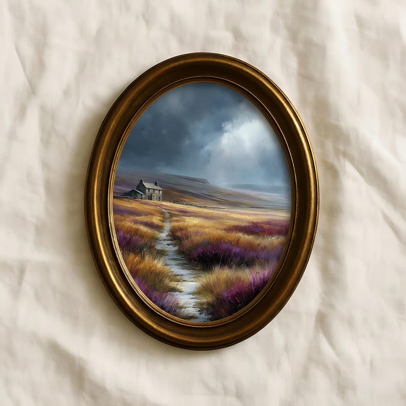 May include: An oval-shaped, gold-colored framed painting depicts a landscape with a small house on a hill. The foreground features a path through fields of yellow and purple flowers under a cloudy sky.