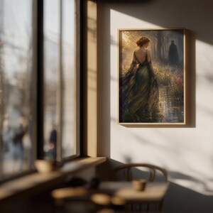May include: A framed art print depicts a woman in a flowing green gown, facing away from the viewer, with a figure in the background. The artwork has a vintage aesthetic, with a warm color palette and a focus on light and shadow.