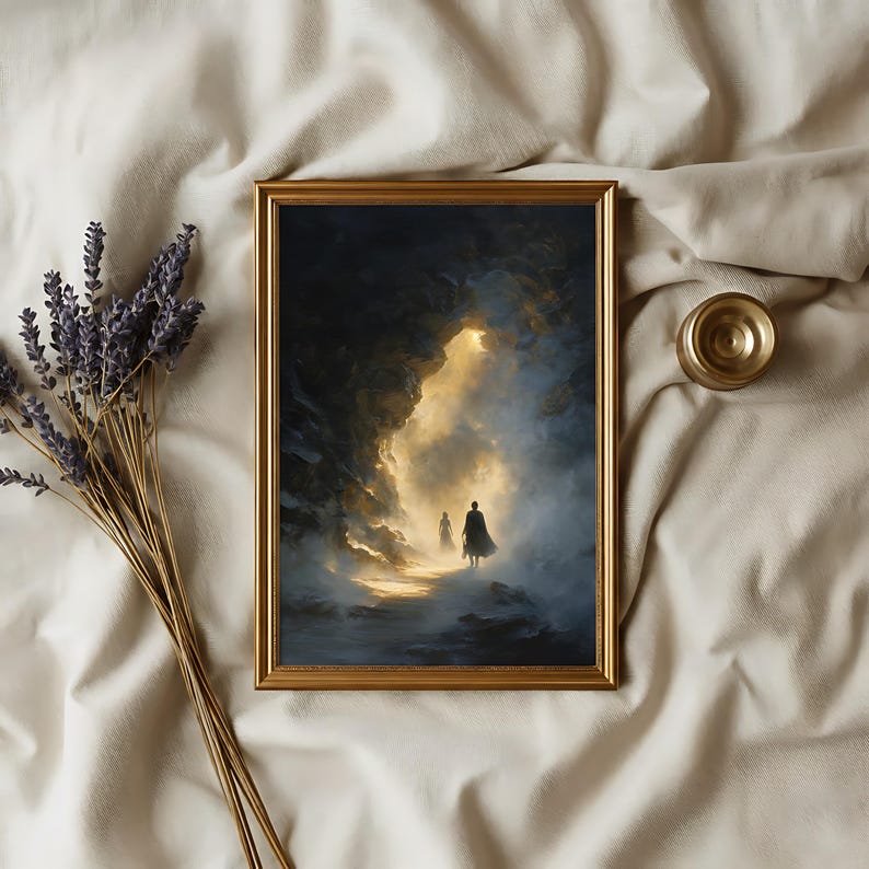 May include: A framed art print with a gold frame depicts two figures walking towards a bright light in a cave. The artwork is in shades of blue, gold, and black. A bundle of lavender and a small gold object are next to the frame.