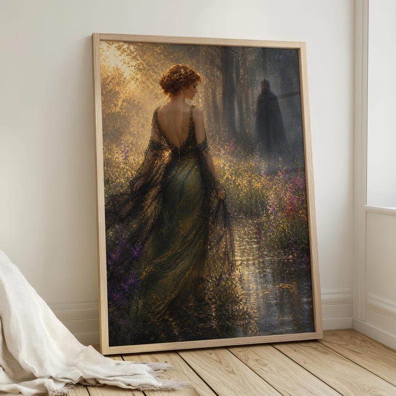 May include: A framed art print depicts a woman in a flowing green gown walking through a sunlit forest. The artwork features a dark figure in the background, with a stream and colorful flowers in the foreground. The print is in a wooden frame.