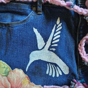 Patchwork Boho AppliquePatched Upcycled Cropped DarkerDenim Cuffed or Straight Jeans SIZE 14 TO 16 Stretch VintageStyledenim.   Inseam 26.  Vintage-look handpainted throughout Flowers, Birds, Cat, and appliques of various designs.  Handmade and handcrafted.   Unique Applique Jeans Distressed.  Highrise High Waisted, Handpainted Handmade Appliqued Straight Style Jeans. Size 14 to 16 depending on your measurements.  Check the measurements.  Handmade Boho Sash Bohemian design crocheted with bells.
