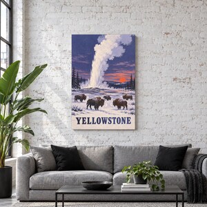 May include: A rectangular wall art print featuring a snowy landscape with a geyser erupting in the background and a herd of brown bison in the foreground. The sky is a deep purple and orange sunset. The word YELLOWSTONE is printed in blue.