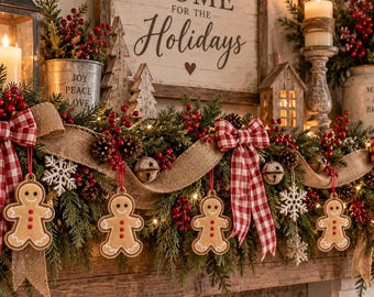 May include: A holiday fireplace mantel garland featuring green pine branches, red berries, pinecones, and burlap ribbon. It is decorated with red and white checkered bows, white snowflake ornaments, and hanging gingerbread man ornaments.